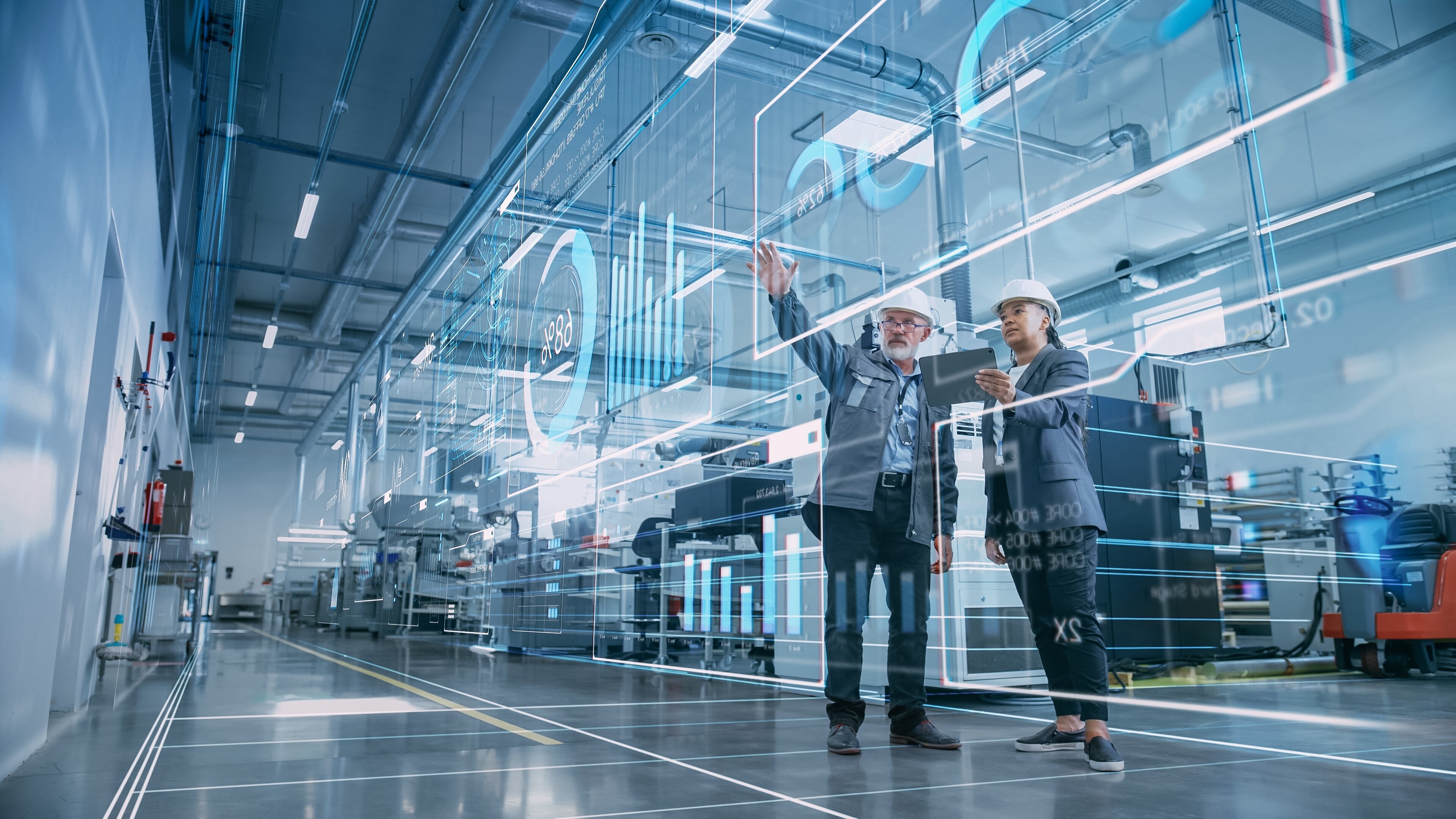 Workers display holographic data in factory hall